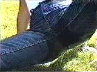 wetting tight jeans sitting on the grass