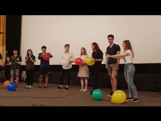 the winner of the competition bursts the balloon)